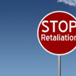 Round highway road sign with text stop retaliation